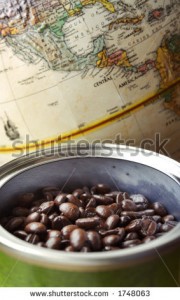 stock-photo-whole-coffee-beans-in-a-can-with-a-map-of-central-america-in-soft-focus-in-the-background-1748063